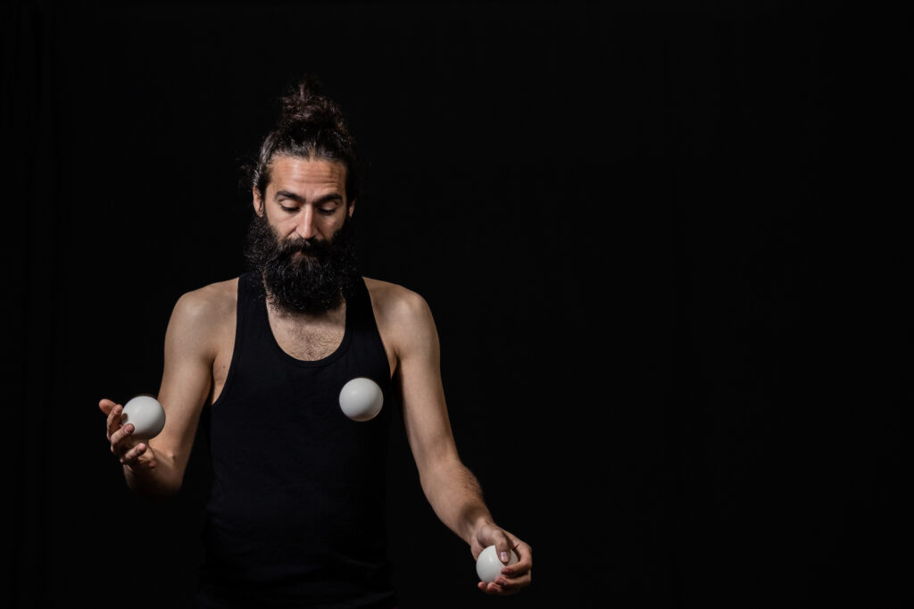 Man Juggling On a Stage